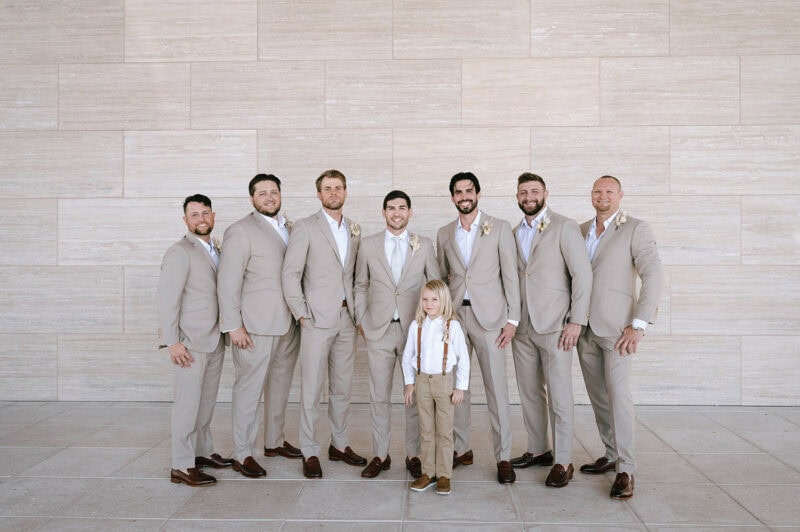 Wedding party group photo at an elegant venue.