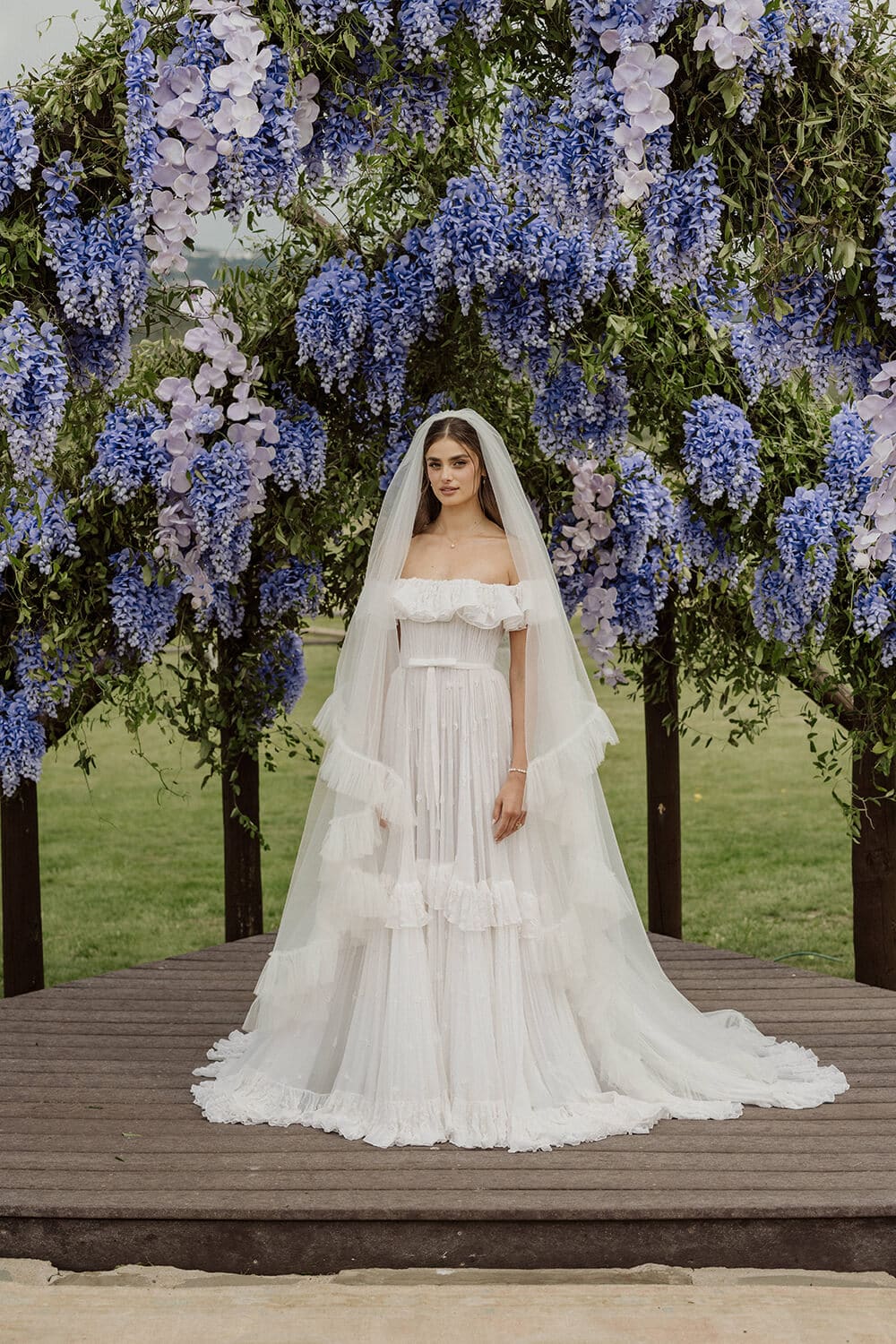 Wedding dress with floral backdrop for a Colorado wedding.