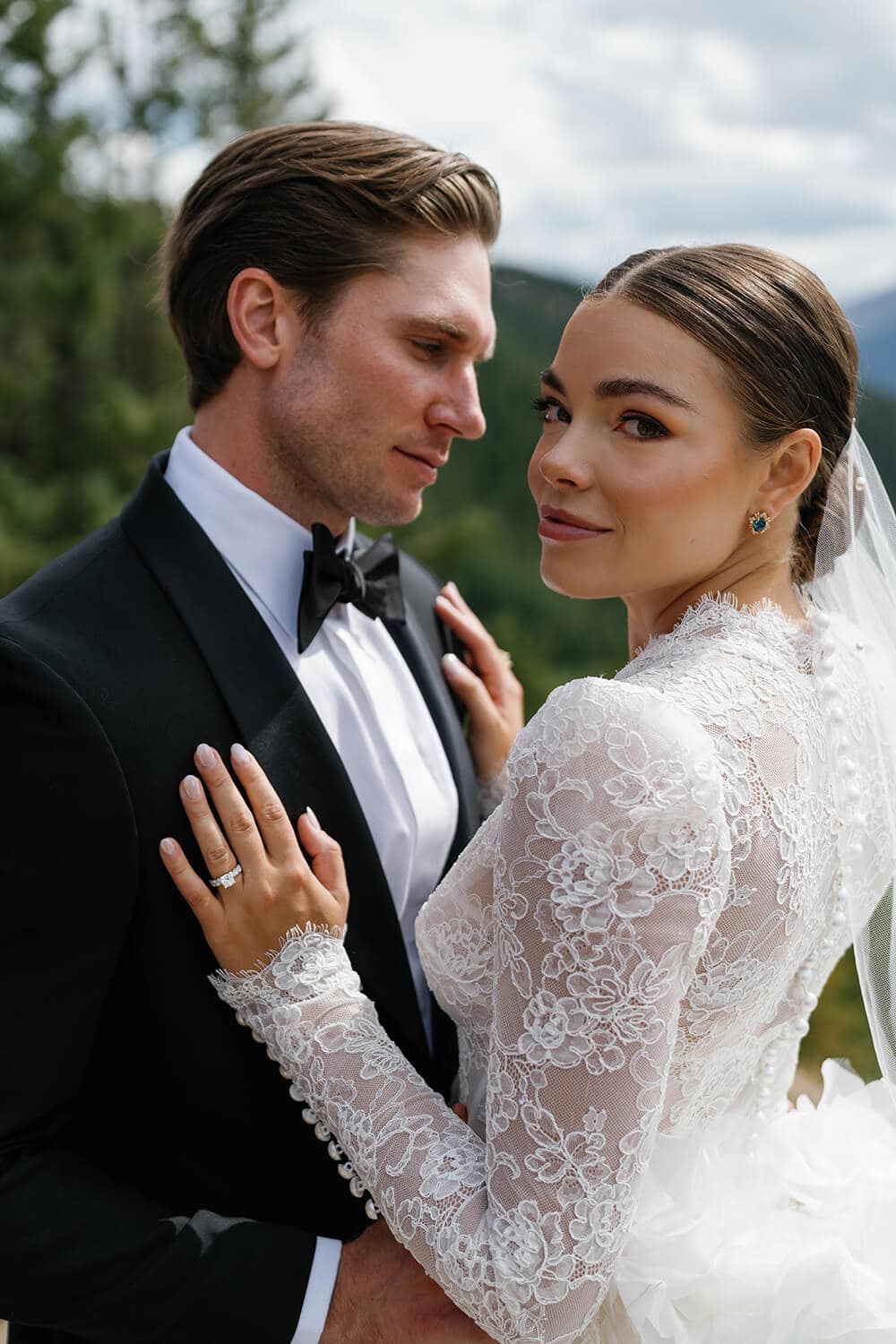 Elegant wedding couple outdoors in Colorado, showcasing love and style.