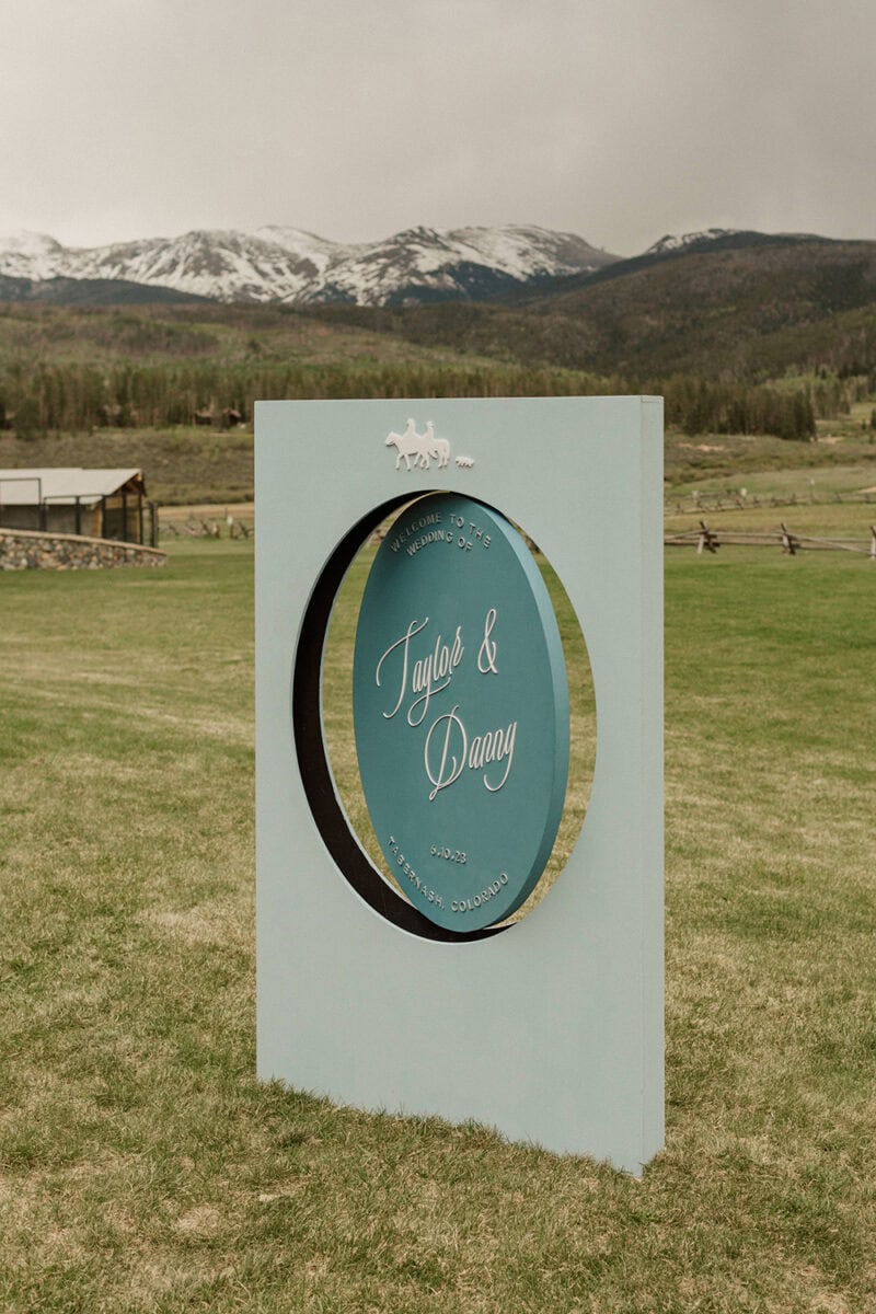 Wedding Sign for Taylor & Danny with mountain scenery in the background.