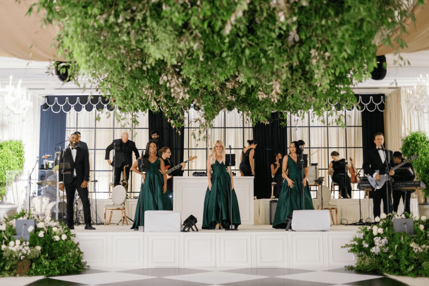 Wedding band performing live on stage during Our Process event.