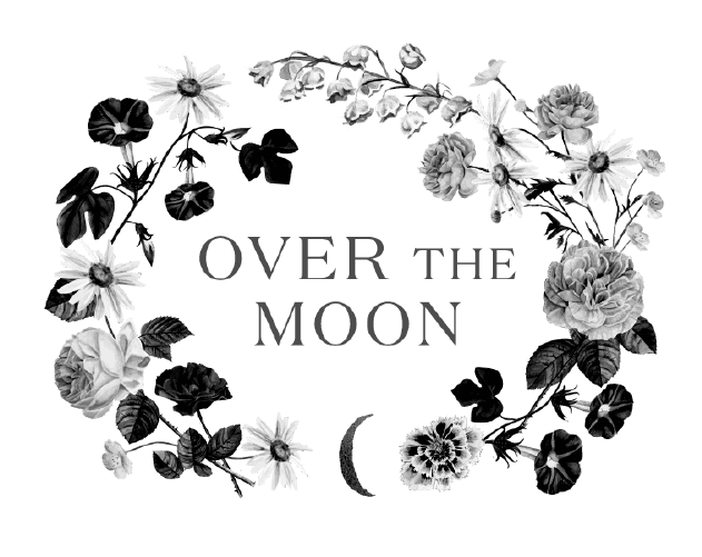 Elegant floral heart with "Over the Moon" text for wedding decor.